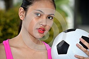 Sporty Asian Female Athlete Portrait With Soccer Ball