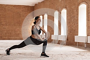 Sporty Beautiful Woman Stretching Leg Muscles, Warming Up Before Training Outdoors