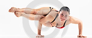 Sporty beautiful young woman practicing yoga, doing lunge exercise, Revolved Side Angle Pose, , working out wearing red