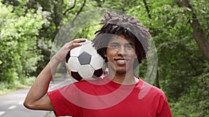 Sporty Black Man Posing With Soccer Ball Smiling Standing Outdoors
