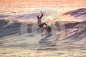 Sporty boy riding his surf board