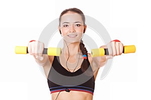 Sporty caucasian woman lifting dumbbells