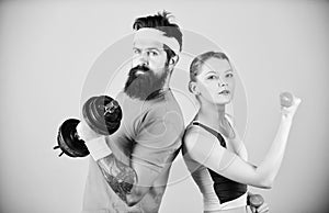 Sporty family. Healthy lifestyle concept. Man and woman exercising with dumbbells. Fitness exercises with dumbbells