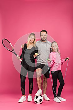 sporty family with sport equipment