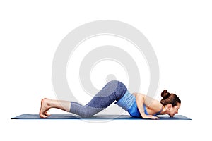 Sporty fit woman practices yoga asana Ashtangasana photo