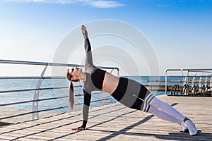 Woman doing planking yoga exercises