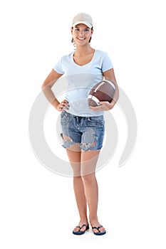 Sporty girl with American football smiling