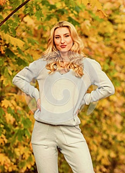 Sporty girl. Girl relaxing in nature wearing knitwear suit. Clothes for rest. Feel practicality and comfort. Model