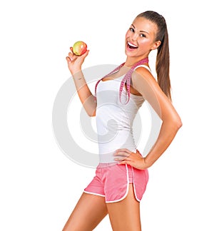 Sporty girl holding an apple