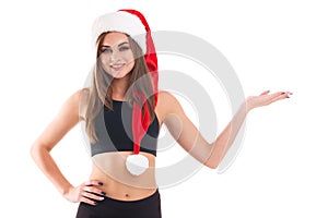 Sporty girl holding her hand palm up against a white isolated background