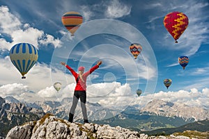 Sporty girl and hot air balloons. Freedom, achievement, achievement, happiness