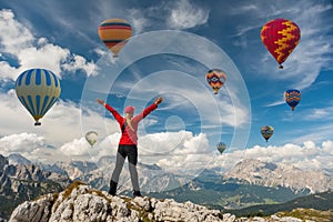 Sporty girl and hot air balloons. Freedom, achievement, achievement, happiness photo