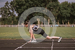 Sporty girl outside. concept of workout. Wellness on stadium