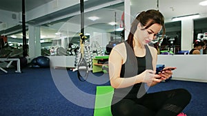 Sporty girl smiling at camera making selfie picture at gym, girl athlete selfie in the gym, Communication in Internet