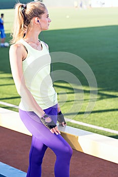 Sporty girl on the stadium