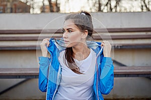 Sporty girl on the stadium. Stadium tribune. Slim sporty fitness woman.