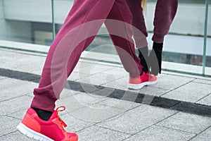 Sporty girl stretching outdoor on city street