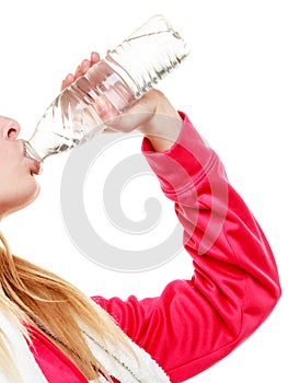 Sporty girl towel on shoulders drinking water