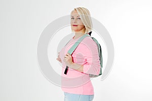 Sporty happy middle age beautiful woman with backpack isolated on white background. Copy space. Mid aged women healthy lifestyle.