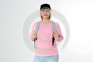 Sporty happy middle age beautiful woman with backpack isolated on white background. Copy space. Mid aged women healthy lifestyle.