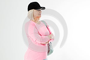 Sporty happy middle age beautiful woman with backpack isolated on white background. Copy space. Mid aged women healthy lifestyle.