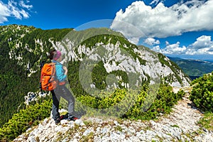 Sporty hiker woman in Carpathians, Piatra Craiului mountains, Transylvania, Romania