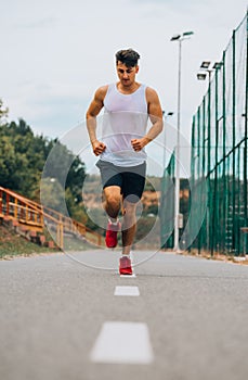 Sporty jogger going for a run in urban city area