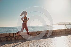 Sporty lady actively jogging by the waterfront