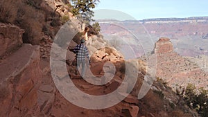 Sporty Man Hiking On A Footpath Trail In Grand Canyon National Park
