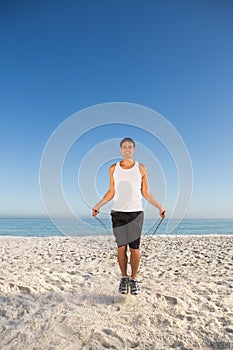 Sporty man jumping rope