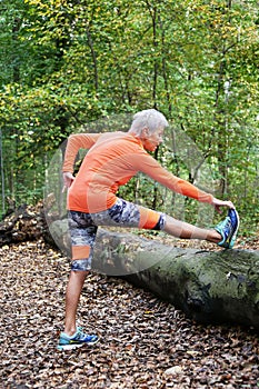 Sporty mature woman stretching