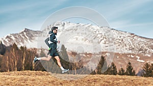 Sporty mountain man rides in trail during endurance trail