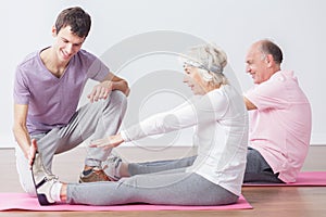 Sporty seniors at fitness studio