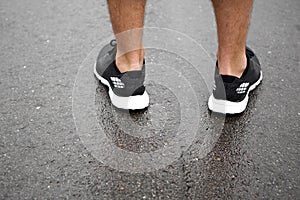 Sporty shoes on pavement