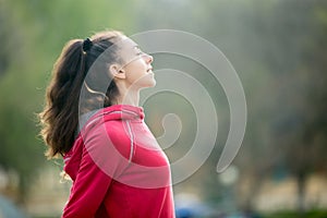 Sporty woman breathing fresh air