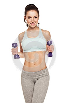 Sporty woman do her workout with dumbbells