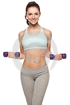 Sporty woman do her workout with dumbbells