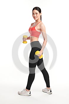 Sporty woman does the exercises with dumbbells on white background, Strength and motivation