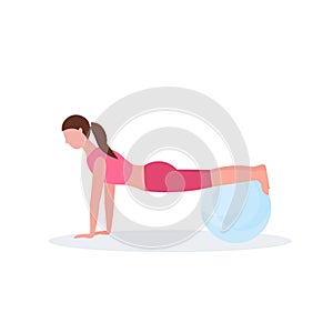 Sporty woman doing exercises with fitness ball girl training in gym aerobic pilates workout healthy lifestyle concept