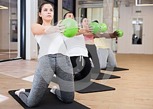 Sporty woman doing exercises with pilates ball