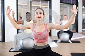 Sporty woman doing exercises with pilates ball