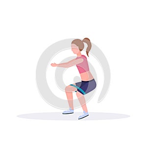 Sporty woman doing exercises with resistance band girl training in gym stretching workout healthy lifestyle concept flat