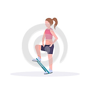 Sporty woman doing exercises with resistance band girl training in gym stretching workout healthy lifestyle concept flat