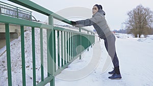 Sporty woman doing push-up strenght exercise at outdoor on bridge