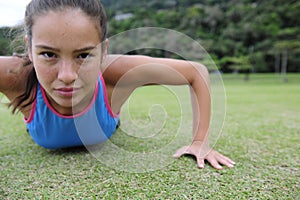 Sporty woman doing push-ups