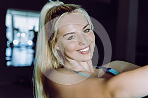 Sporty woman doing TRX exercises in the gym - Image