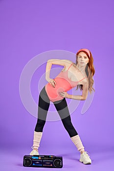 Sporty woman doing waist exercises, side bendings hands at hips