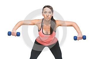 Sporty woman with dumbbells