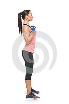 Sporty woman with dumbbells