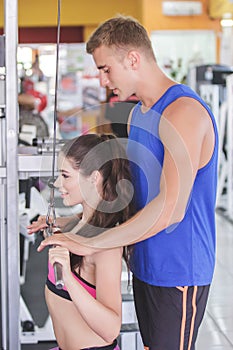 Sporty woman exercising with her trainer